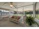Covered screened porch featuring wicker furniture and a backyard view at 61 Brown Sw St, Concord, NC 28027