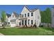 Charming two-story home with a well-manicured lawn and a classic gray exterior, perfect for modern living at 7113 Fowley Rd # 0336, Charlotte, NC 28269