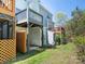 Backyard view of multiple decks, green grass and storage at 753 Mountainwater Dr, Charlotte, NC 28262