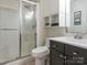 Modern bathroom featuring a glass-enclosed shower, sleek vanity, and contemporary fixtures at 753 Mountainwater Dr, Charlotte, NC 28262