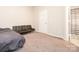 Bedroom featuring a black futon and carpeted floors at 753 Mountainwater Dr, Charlotte, NC 28262