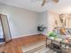 Living room featuring wood flooring, a mirror, and comfortable seating at 753 Mountainwater Dr, Charlotte, NC 28262