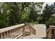 Wooden stairs lead to a backyard, perfect for enjoying nature and outdoor activities at 8608 Cedarbrook Dr, Charlotte, NC 28215