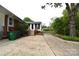 An expansive patio seamlessly merges with the screened porch and a tranquil backyard for outdoor enjoyment at 8608 Cedarbrook Dr, Charlotte, NC 28215