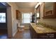 Bathroom with double sinks, granite countertops, and a window with stained glass at 8608 Cedarbrook Dr, Charlotte, NC 28215