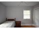 Bedroom featuring hardwood floors, a ceiling fan, and natural light at 8608 Cedarbrook Dr, Charlotte, NC 28215