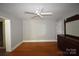 Bedroom with hardwood floors, ceiling fan, and plenty of space at 8608 Cedarbrook Dr, Charlotte, NC 28215