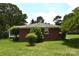 Brick home with mature trees offering a serene and private setting at 8608 Cedarbrook Dr, Charlotte, NC 28215