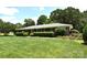 Well-maintained brick home featuring lush lawn and landscaping for great curb appeal at 8608 Cedarbrook Dr, Charlotte, NC 28215