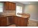 Kitchen featuring granite countertops, stainless steel dishwasher, and island with seating for four at 8608 Cedarbrook Dr, Charlotte, NC 28215