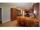 Spacious kitchen with stainless steel appliances, granite countertops, an island with chairs, and ample cabinet storage at 8608 Cedarbrook Dr, Charlotte, NC 28215