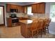 Well-lit kitchen features granite countertops, stainless steel appliances, and ample cabinet space at 8608 Cedarbrook Dr, Charlotte, NC 28215