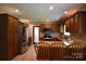 Spacious kitchen featuring stainless steel appliances and generous cabinet space at 8608 Cedarbrook Dr, Charlotte, NC 28215