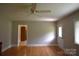 Open living room featuring hardwood floors and neutral paint at 8608 Cedarbrook Dr, Charlotte, NC 28215