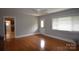 The living room features hardwood floors, natural light, and neutral walls at 8608 Cedarbrook Dr, Charlotte, NC 28215