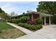 The home features a brick exterior, mature landscaping, and a covered carport at 8608 Cedarbrook Dr, Charlotte, NC 28215