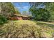 Expansive backyard featuring a well-maintained lawn and mature trees providing shade and privacy for outdoor enjoyment at 900 E Woodlawn Rd, Charlotte, NC 28209