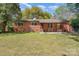 Spacious backyard of a brick home, perfect for entertaining at 900 E Woodlawn Rd, Charlotte, NC 28209