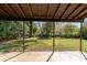 Covered patio overlooks the spacious, shady, private backyard at 900 E Woodlawn Rd, Charlotte, NC 28209