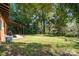Large backyard with covered patio perfect for entertaining and relaxing at 900 E Woodlawn Rd, Charlotte, NC 28209