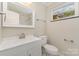 Bathroom featuring modern fixtures, a new vanity, and a clean design at 900 E Woodlawn Rd, Charlotte, NC 28209