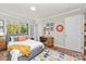 Cozy bedroom features a comfortable bed, a study desk, and stylish decor for a personalized space at 900 E Woodlawn Rd, Charlotte, NC 28209