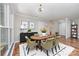 Formal dining room with modern lighting, wood floors, and elegant decor at 900 E Woodlawn Rd, Charlotte, NC 28209