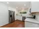Bright kitchen featuring stainless steel appliances and a sleek countertop at 900 E Woodlawn Rd, Charlotte, NC 28209