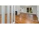 Open living room layout showcasing hardwood floors, a fireplace, and ample natural light at 900 E Woodlawn Rd, Charlotte, NC 28209