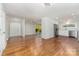 Bright living room and modern kitchen with stainless steel appliances and hardwood floors at 900 E Woodlawn Rd, Charlotte, NC 28209