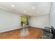 Bright living room with hardwood floors, fireplace and large windows at 900 E Woodlawn Rd, Charlotte, NC 28209
