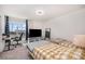 Bright bedroom with two beds, workspace with large window, and comfortable desk chair at 9031 Odell Corners Nw Blvd, Concord, NC 28027