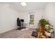 Bedroom with large window, plants, and ergonomic chair and desk setup at 9031 Odell Corners Nw Blvd, Concord, NC 28027