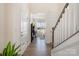 Bright and open foyer with staircase, hardwood floors, and ample natural light at 9031 Odell Corners Nw Blvd, Concord, NC 28027