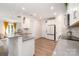 Contemporary kitchen featuring gray countertops, white cabinets, and modern appliances at 9031 Odell Corners Nw Blvd, Concord, NC 28027