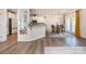 Open-concept kitchen with an island, dining area, and views of the living space at 9031 Odell Corners Nw Blvd, Concord, NC 28027