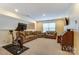 Finished basement featuring comfortable seating and a home workout area at 10421 Dominion Village Dr, Charlotte, NC 28269
