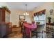 Charming dining room with hardwood floors, elegant chandelier and lovely decor at 10421 Dominion Village Dr, Charlotte, NC 28269