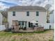 Spacious backyard with a patio, outdoor kitchen, fireplace, and a well-maintained lawn at 10694 Sapphire Trl, Davidson, NC 28036