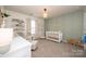 A charming Bedroom featuring soft green accents, a crib, and whimsical decor at 10694 Sapphire Trl, Davidson, NC 28036