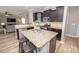 Kitchen island with granite countertop, stainless steel appliances and seating for casual dining at 10694 Sapphire Trl, Davidson, NC 28036
