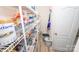 Walk-in pantry featuring wire shelving for organized food storage and household items at 10694 Sapphire Trl, Davidson, NC 28036