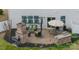 Outdoor patio featuring an outdoor kitchen, fireplace, pergola and comfortable seating at 10694 Sapphire Trl, Davidson, NC 28036