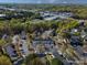 An aerial view showcases the community's lush landscaping, parking areas, and nearby commercial area at 107 Forester St, Mooresville, NC 28117