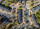 An aerial view of townhomes showing the parking areas, landscaping, and street layout at 107 Forester St, Mooresville, NC 28117