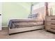 Comfortable bedroom with soft carpet, a large bed, and a bedside table at 107 Forester St, Mooresville, NC 28117