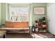 Comfortable bedroom with a large window, a tan futon and a cozy atmosphere at 107 Forester St, Mooresville, NC 28117