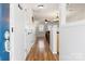 Bright entryway features gleaming hardwood floors and an open view into the adjacent living spaces at 107 Forester St, Mooresville, NC 28117