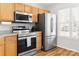 Well-equipped kitchen featuring stainless steel appliances and sleek countertops for modern convenience at 107 Forester St, Mooresville, NC 28117