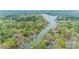 Stunning aerial view of lakefront homes surrounded by lush greenery and serene waters at 113 Hidden Ln, Mooresville, NC 28117